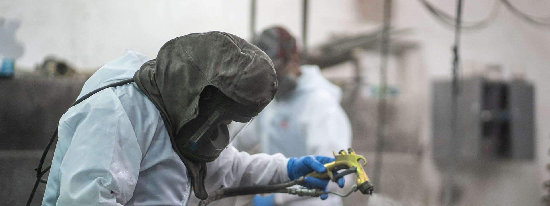 Newmar employee PPE finishing